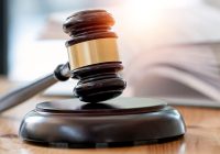 Wooden brown judge gavel on the table, copy space, banner background.