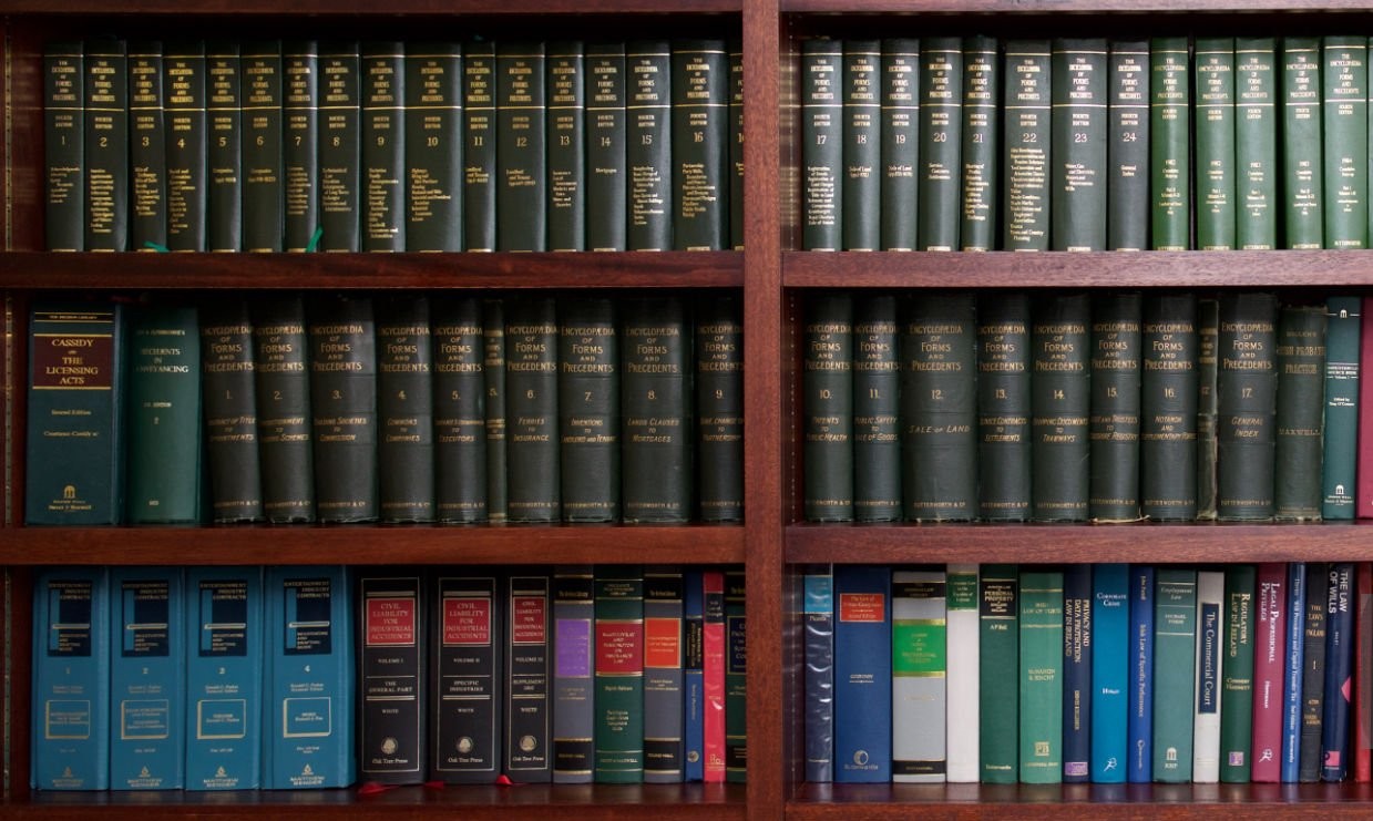 A bookshelf containing volumes of books about Irish Law.